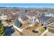 Aerial view of a neighborhood featuring mature trees and mountain views at 4315 Bella Vista Dr, Longmont, CO 80503