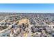 Wide aerial shot of a suburban neighborhood, showcasing a community layout with homes and green spaces at 4315 Bella Vista Dr, Longmont, CO 80503