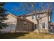 Backyard featuring a grassy yard, privacy fence, and a two-story home at 4315 Bella Vista Dr, Longmont, CO 80503