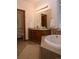 Bright bathroom featuring a soaking tub, double sink vanity, and updated fixtures at 4315 Bella Vista Dr, Longmont, CO 80503