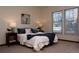 Tranquil bedroom featuring plush bedding, neutral decor, and bright natural light at 4315 Bella Vista Dr, Longmont, CO 80503