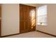 Bedroom with a closet featuring sliding wood doors and a bright window at 4315 Bella Vista Dr, Longmont, CO 80503