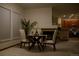 Cozy dining area features fireplace and open access to the modern kitchen area at 4315 Bella Vista Dr, Longmont, CO 80503