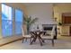 Charming dining area with modern table set, fireplace, and bright natural light at 4315 Bella Vista Dr, Longmont, CO 80503
