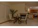 Cozy dining area features fireplace and open access to the modern kitchen area at 4315 Bella Vista Dr, Longmont, CO 80503