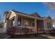Inviting exterior of a two-story home featuring a charming front porch and well-maintained landscaping at 4315 Bella Vista Dr, Longmont, CO 80503