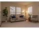 Comfortable living room bathed in sunlight, featuring neutral color palette and stylish furnishings at 4315 Bella Vista Dr, Longmont, CO 80503