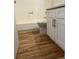 Bathroom featuring wood look flooring and white vanity with a tub at 10792 E Exposition Ave # 352, Aurora, CO 80012