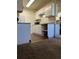 Bright kitchen featuring white cabinets and new countertops at 10792 E Exposition Ave # 352, Aurora, CO 80012