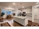 Spacious kitchen featuring a large island, stainless steel appliances, and ample cabinet space at 11560 Kalispell St, Commerce City, CO 80022