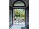 Inviting entryway showcasing an open door and manicured front lawn at 5345 S Race Ct, Greenwood Village, CO 80121