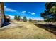 Expansive backyard with lush lawn and mature trees, ideal for outdoor activities and relaxation at 6936 S Chapparal W Cir, Centennial, CO 80016