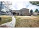 Spacious backyard with stone pathway leading to the house, perfect for outdoor activities and entertaining at 6936 S Chapparal W Cir, Centennial, CO 80016