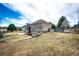 Wide angle of large backyard with lush lawn, mature trees, and views at 6936 S Chapparal W Cir, Centennial, CO 80016