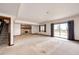Basement Gathering room with brick fireplace and sliding glass doors to the backyard at 6936 S Chapparal W Cir, Centennial, CO 80016