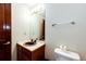 Bathroom featuring a tile countertop, wood cabinets and a toilet at 6936 S Chapparal W Cir, Centennial, CO 80016