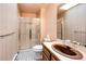 Bathroom featuring a glass shower, tile flooring, and a granite countertop at 6936 S Chapparal W Cir, Centennial, CO 80016