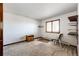 Empty bedroom featuring a window, carpet flooring and a closet at 6936 S Chapparal W Cir, Centennial, CO 80016