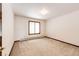 Empty bedroom with plush carpeting, natural light from window, ready for your personal touch at 6936 S Chapparal W Cir, Centennial, CO 80016