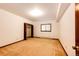 Bedroom with a closet and natural light, featuring carpet flooring and baseboard heating at 6936 S Chapparal W Cir, Centennial, CO 80016