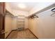 Walk-in closet with shelving and hanging rods for optimal storage and organization at 6936 S Chapparal W Cir, Centennial, CO 80016