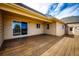 Large wooden deck featuring sliding glass doors, offering an excellent outdoor entertaining space at 6936 S Chapparal W Cir, Centennial, CO 80016