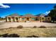 Charming ranch-style home with manicured lawn and front-facing three-car garage at 6936 S Chapparal W Cir, Centennial, CO 80016