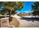 Expansive ranch home with lush trees, long driveway, and three-car garage at 6936 S Chapparal W Cir, Centennial, CO 80016