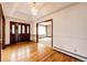 Bright foyer with hardwood floors, chandelier and stylish doorway trim at 6936 S Chapparal W Cir, Centennial, CO 80016