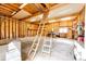 Garage with a high ceiling and wooden frame, offering a versatile space for storage and projects at 6936 S Chapparal W Cir, Centennial, CO 80016