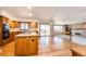 Spacious kitchen featuring an island cooktop, lots of cabinet space and hardwood floors at 6936 S Chapparal W Cir, Centennial, CO 80016