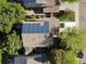 Aerial view of home showcasing the installed solar panels on the roof and the surrounding trees at 1250 S Boyero Ct, Superior, CO 80027