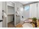 This remodeled bathroom features dual sinks, a shower, and a walk-in closet at 1250 S Boyero Ct, Superior, CO 80027