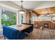 Bright dining area with custom banquette seating and large windows, adjacent to the living room at 1250 S Boyero Ct, Superior, CO 80027