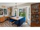 Cozy dining area with custom banquette seating and large windows overlooking the backyard at 1250 S Boyero Ct, Superior, CO 80027