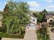 Two-story home with trees, well-maintained lawn, and a two-car garage at 1250 S Boyero Ct, Superior, CO 80027