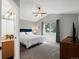 This bright main bedroom has plush carpet, large windows, and a ceiling fan at 1250 S Boyero Ct, Superior, CO 80027