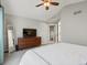 This spacious main bedroom has plush carpet, a TV, and an en-suite bathroom at 1250 S Boyero Ct, Superior, CO 80027