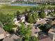 Beautiful neighborhood view, with a lake nearby, showcasing the lovely homes and lush landscaping at 1250 S Boyero Ct, Superior, CO 80027