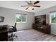 This office features a ceiling fan, a desk, and built in shelving at 1250 S Boyero Ct, Superior, CO 80027