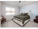 Spacious bedroom with carpeted floor and large window at 8602 Gold Peak Dr # F, Highlands Ranch, CO 80130