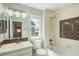 Bathroom with a shower-tub combo and a large window for great natural light at 3116 Black Canyon Way, Castle Rock, CO 80109