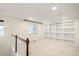 Spacious bonus room with built-in bookshelves and a cozy, carpeted floor at 3116 Black Canyon Way, Castle Rock, CO 80109