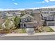 Beautiful two-story home with a well-maintained lawn, mature trees and a two car garage in a suburban neighborhood at 3116 Black Canyon Way, Castle Rock, CO 80109
