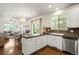 Bright kitchen with white cabinets, stainless steel appliances, and hardwood floors at 3116 Black Canyon Way, Castle Rock, CO 80109