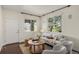Bright living room featuring hardwood floors, neutral walls, lots of natural light and stylish furnishings at 3116 Black Canyon Way, Castle Rock, CO 80109