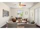 Modern living room with hardwood floors, neutral decor, and stylish furniture at 3116 Black Canyon Way, Castle Rock, CO 80109