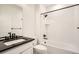 Bathroom showcasing a modern single sink vanity and tiled shower at 2507 W 69Th Pl, Denver, CO 80221