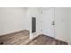Entryway featuring wood-look floors and a white door at 2507 W 69Th Pl, Denver, CO 80221