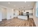 Bright kitchen featuring white cabinets, black countertops, and stainless steel appliances at 2507 W 69Th Pl, Denver, CO 80221